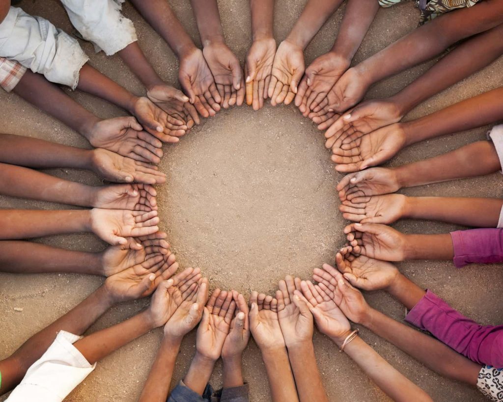 A circle formed by hands